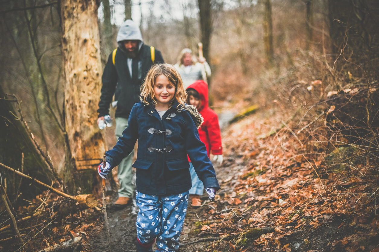 Child with her family on a winter hike